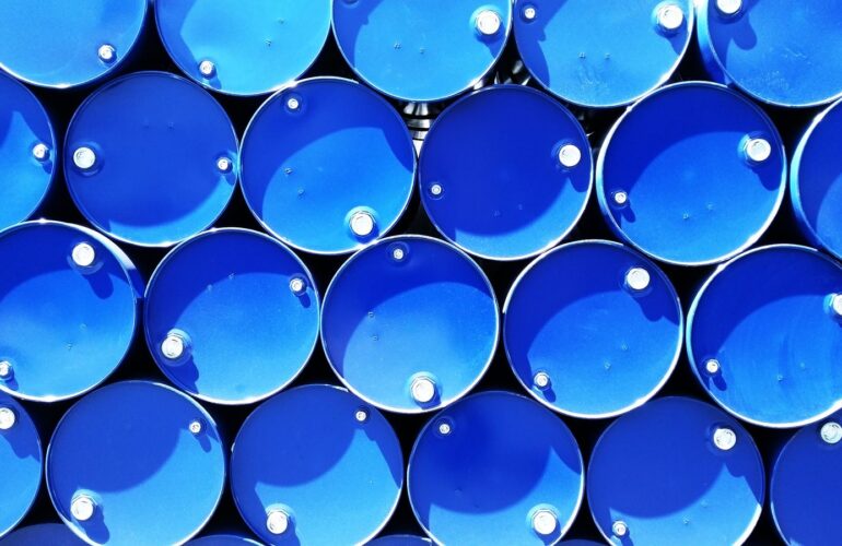 Stacked blue industrial chemical drums